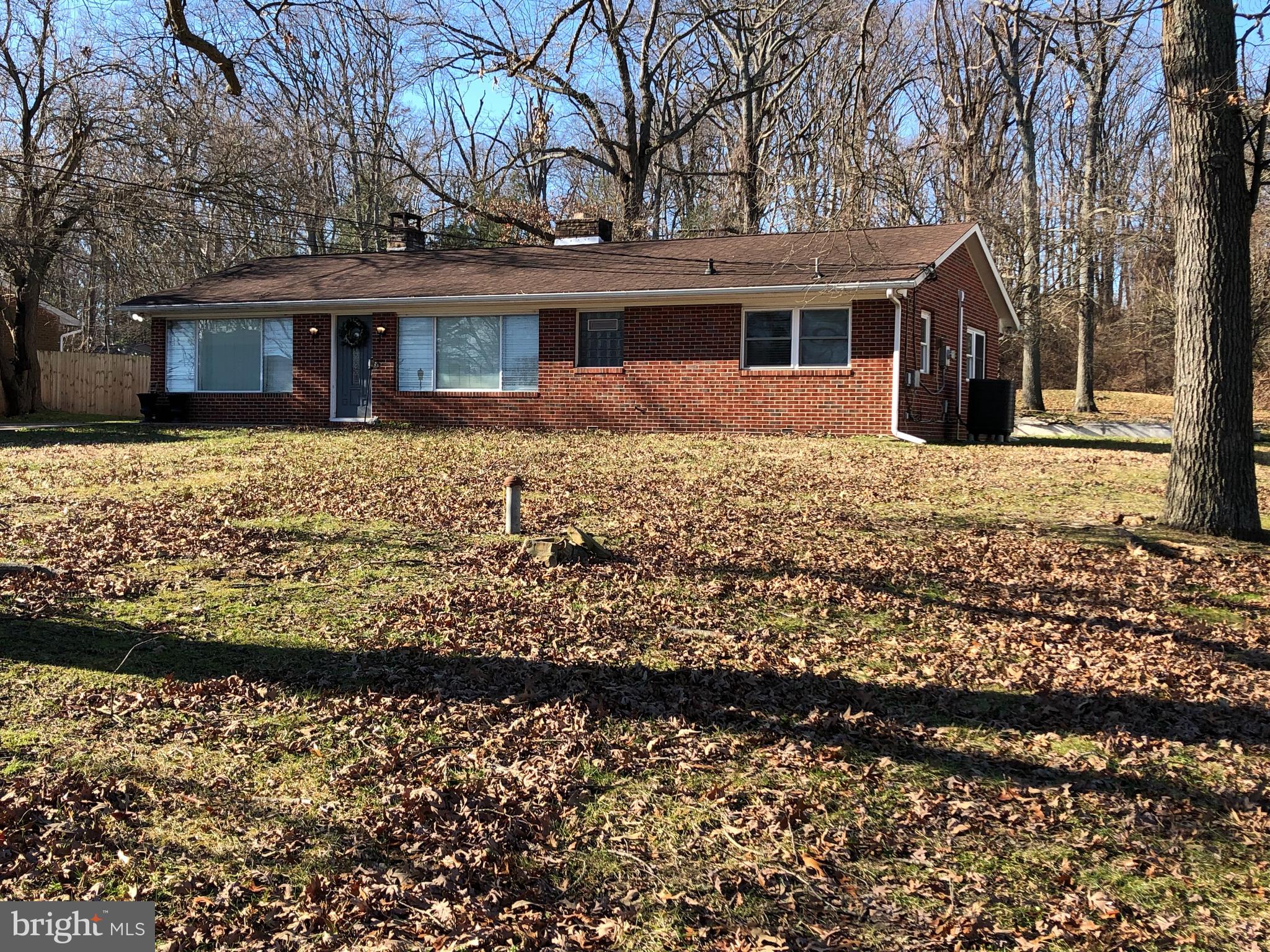 front view of a house with a garden