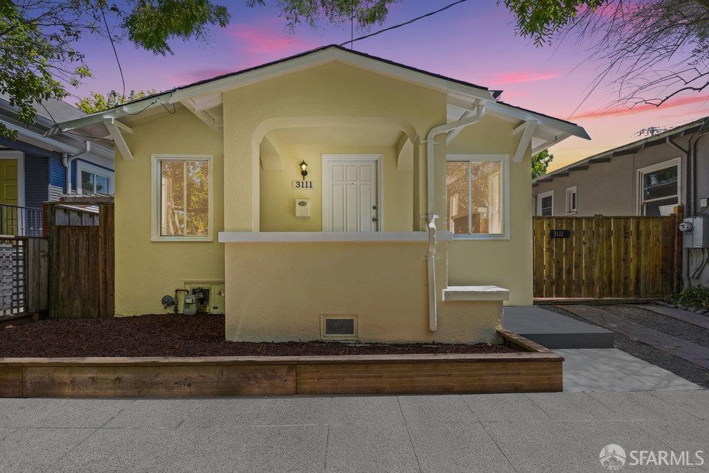 a view of a house with a small yard