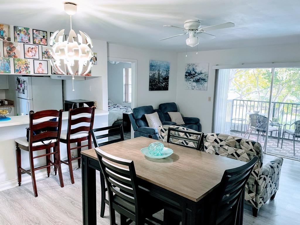 a view of a dining room with furniture window and outside view