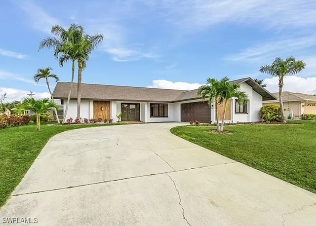 a front view of house with yard and green space