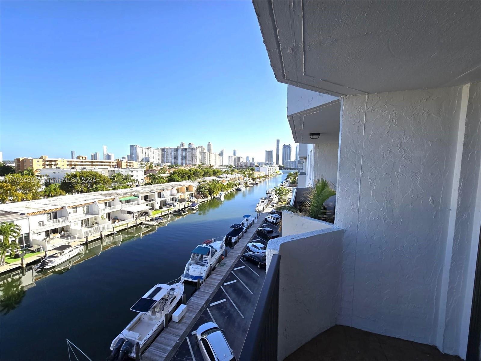 a view of a balcony with furniture