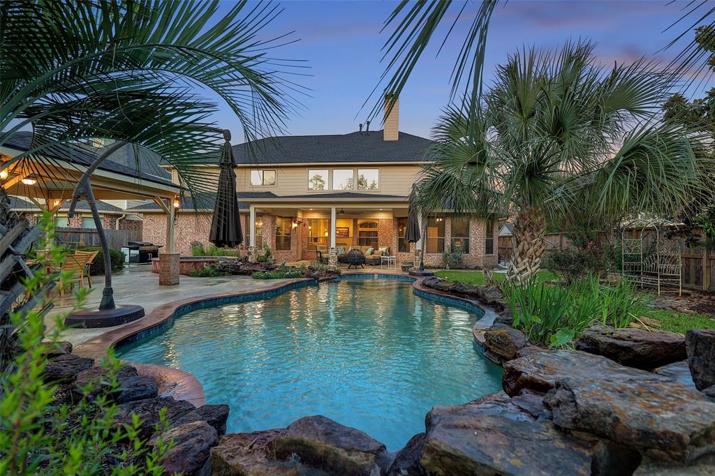 a view of a swimming pool with a patio