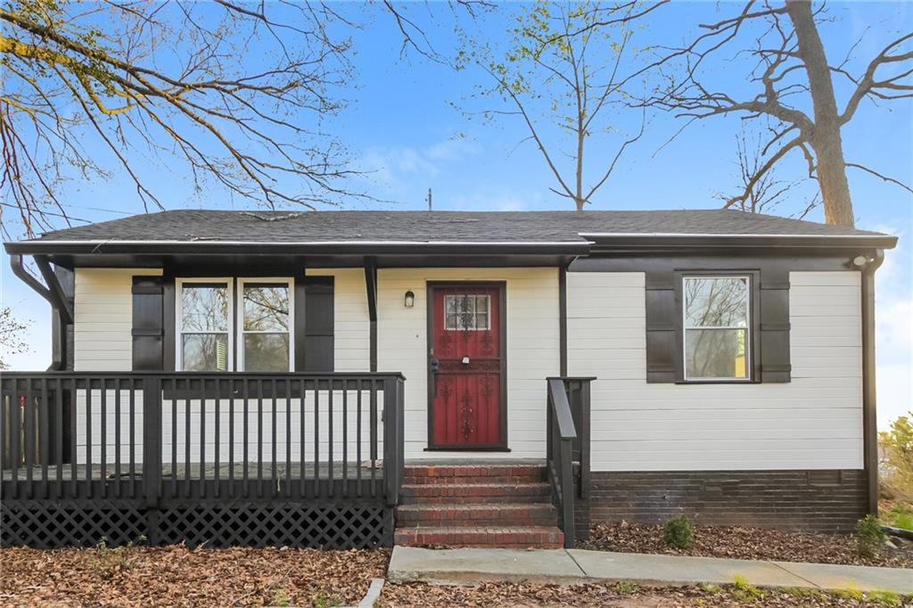 a front view of a house with a small yard