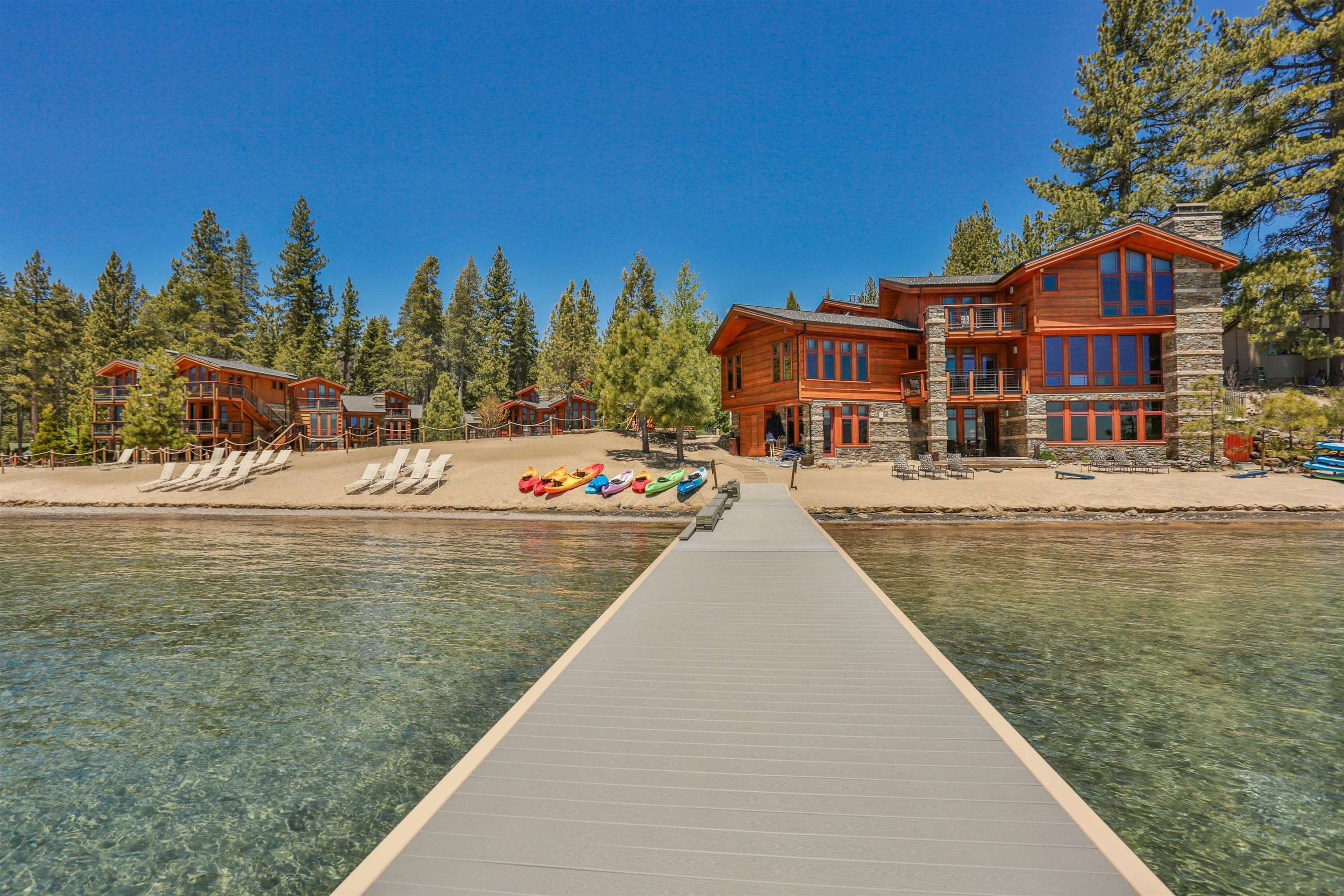 a view of a lake with a building and trees in the background