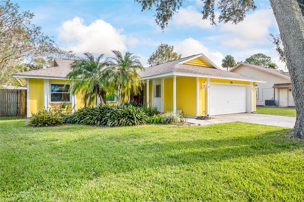 a view of a house with a backyard