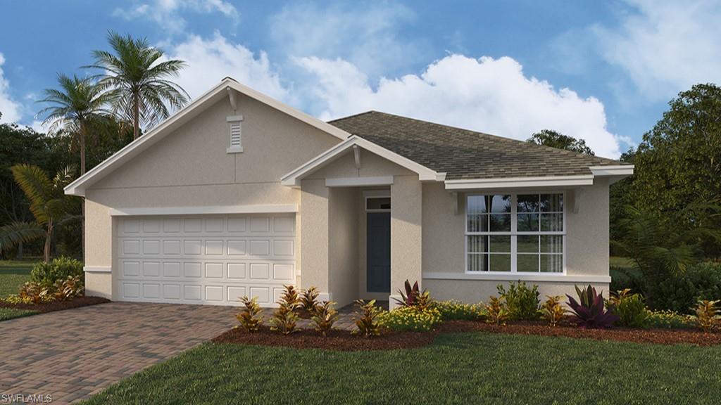 View of front of house with a front lawn and a garage