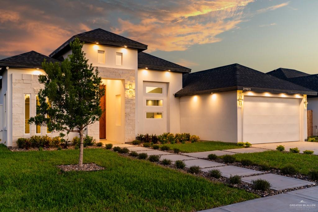 a front view of a house with a yard