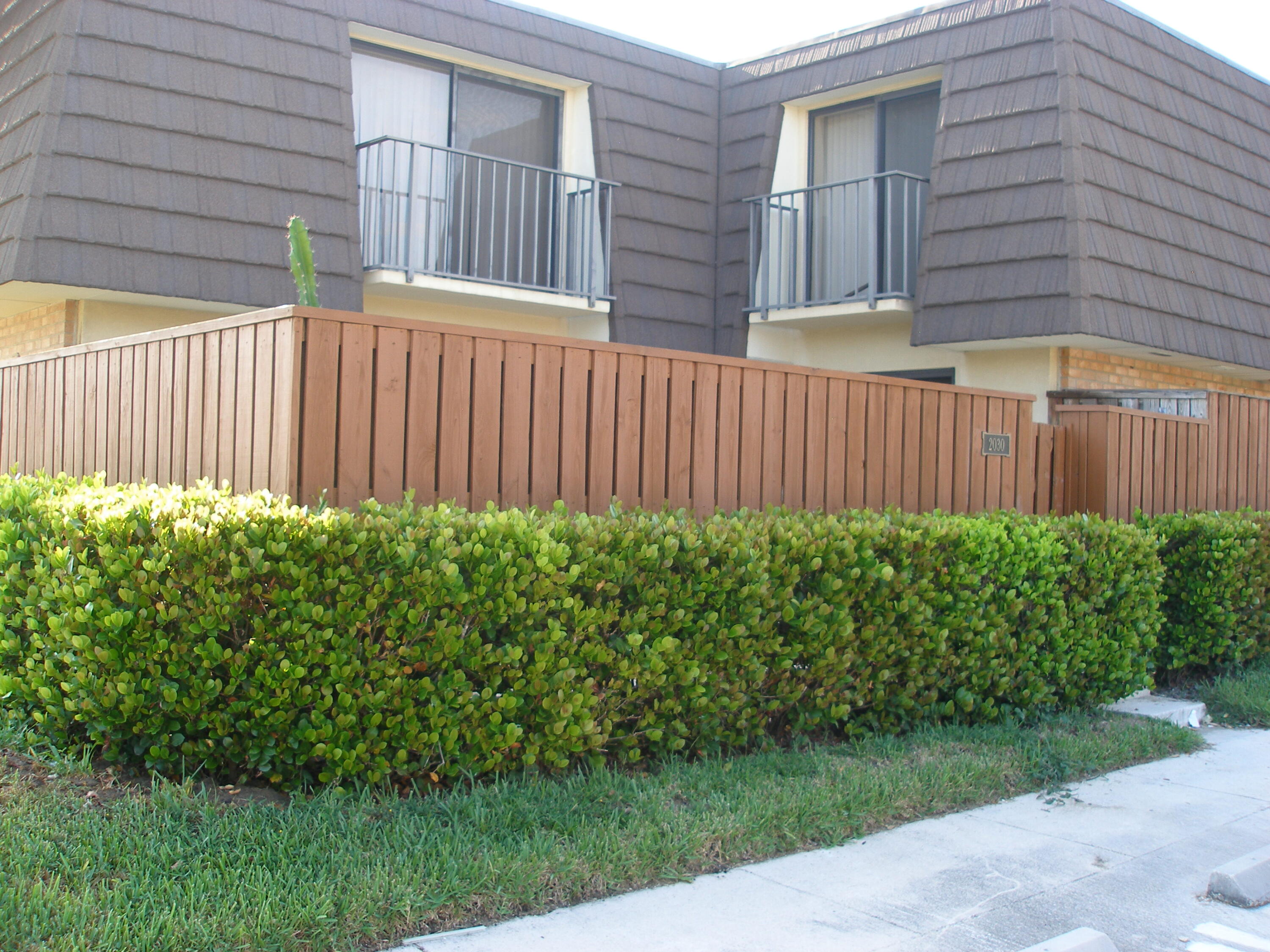 a view of a house with a garden