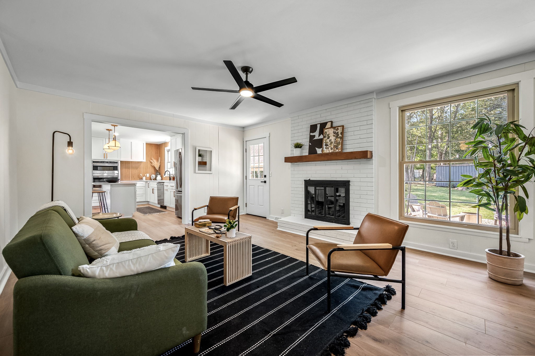 Main living room off the kitchen. Living room looks out to huge backyard.