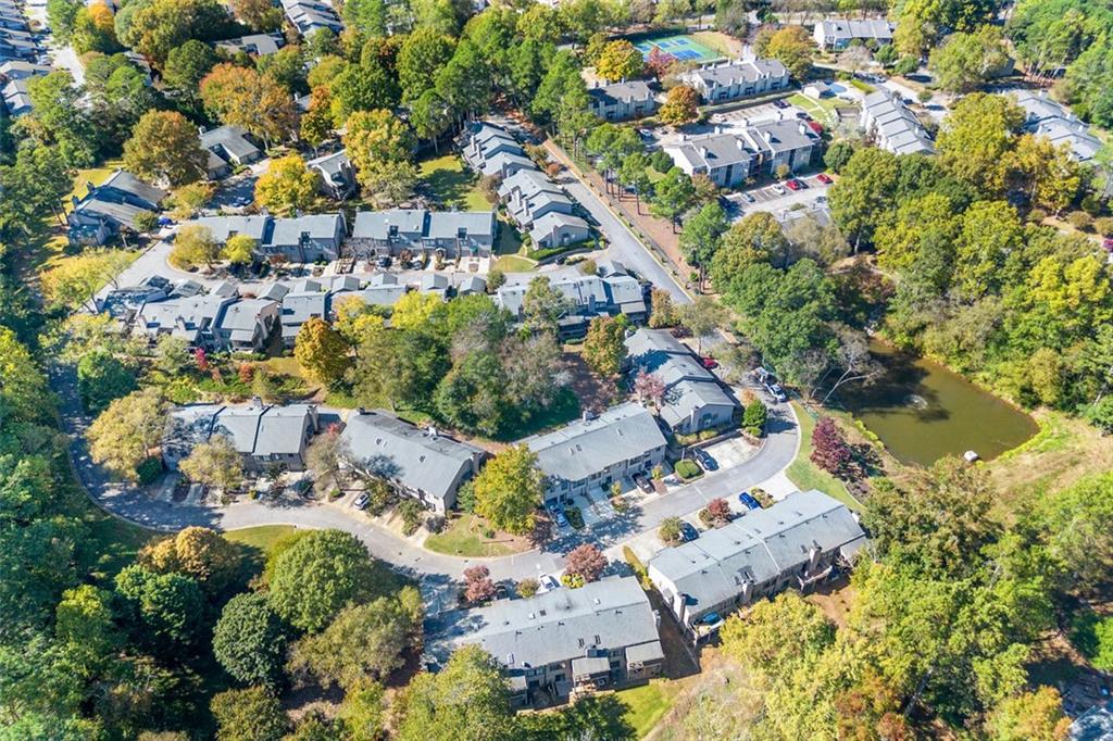 an aerial view of residential houses with outdoor space