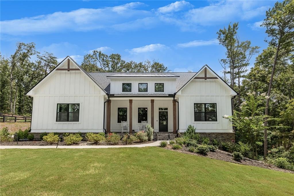 a front view of a house with a yard