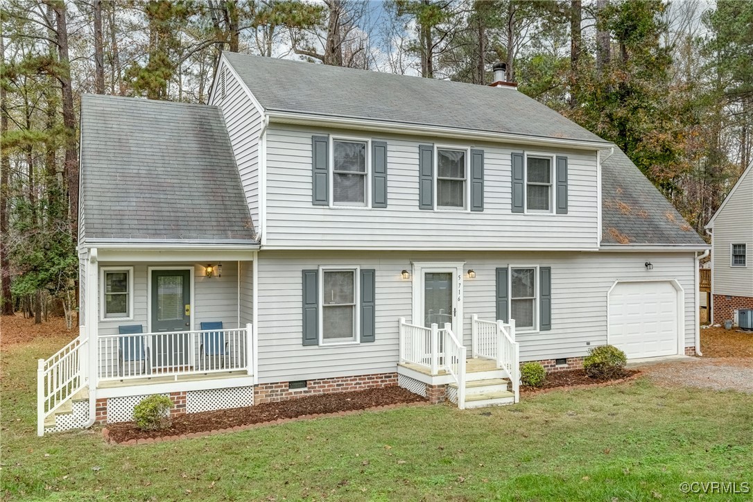 View of front of home featuring a garage and a fro