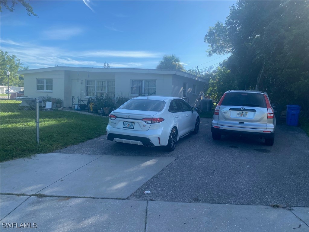 a view of a car in back of a house