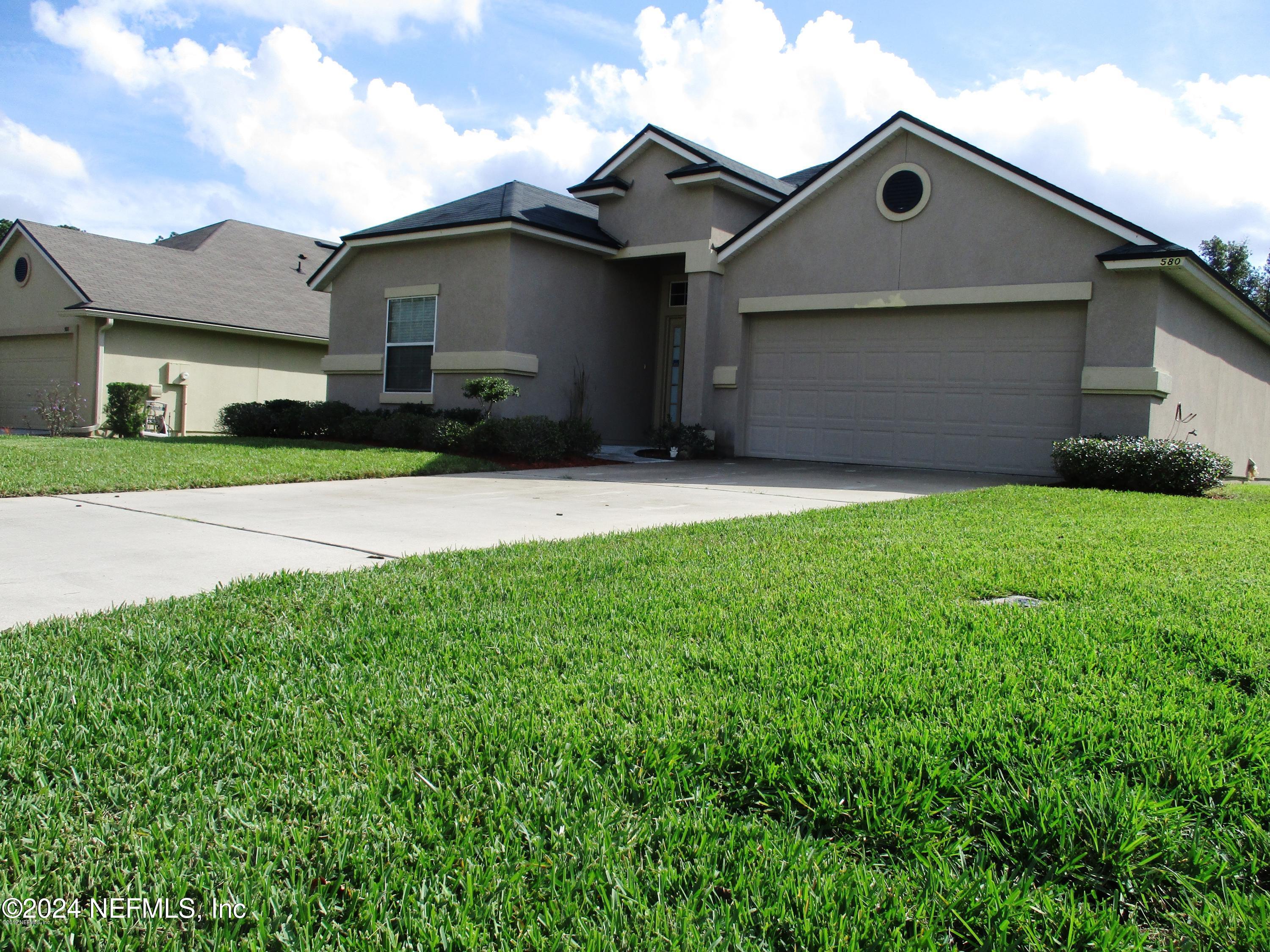 front view of house with a yard