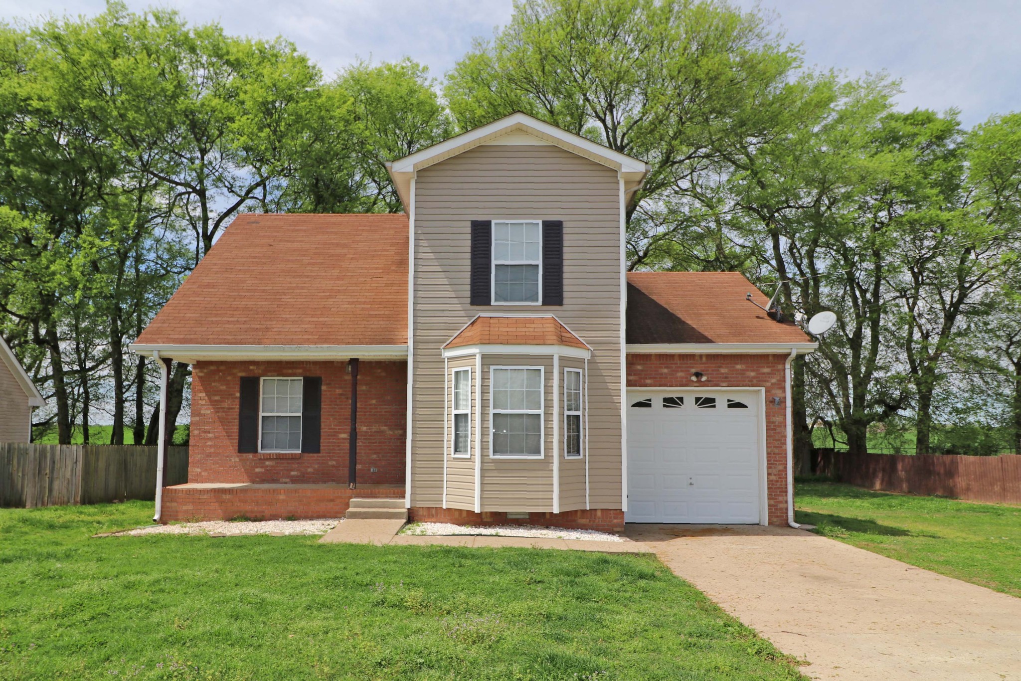 front view of a house with a yard