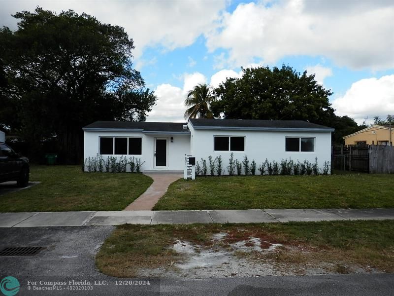 front view of a house and a yard