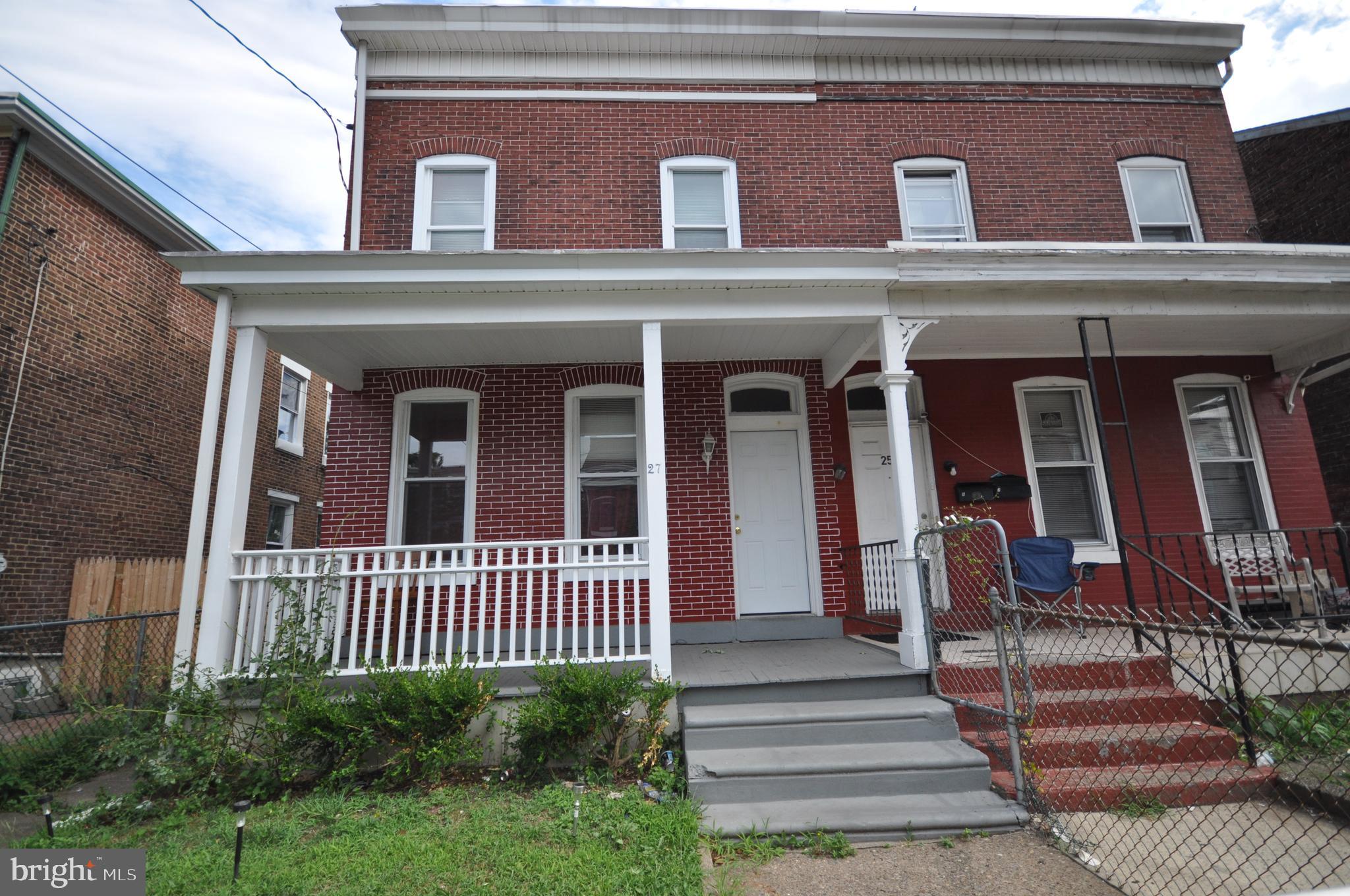 a front view of a house with a porch