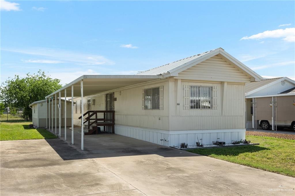 a view of a house with a yard