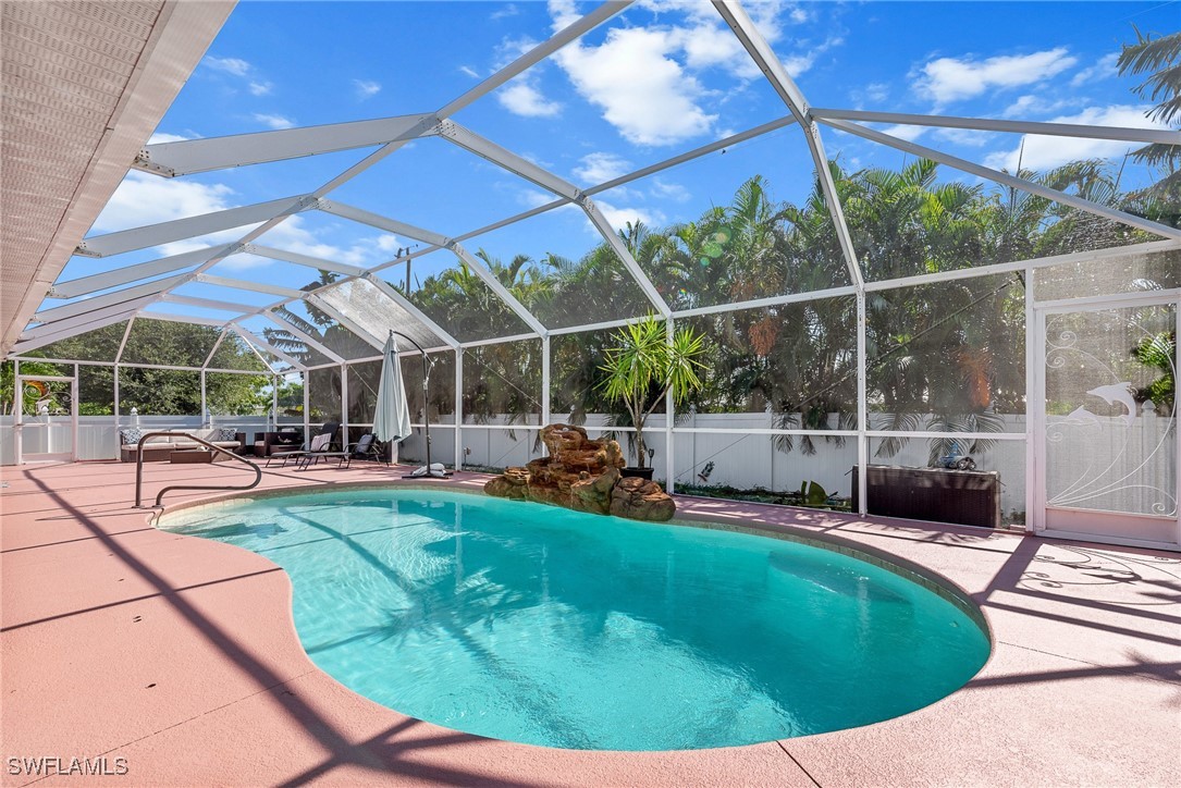 a view of a swimming pool with a patio