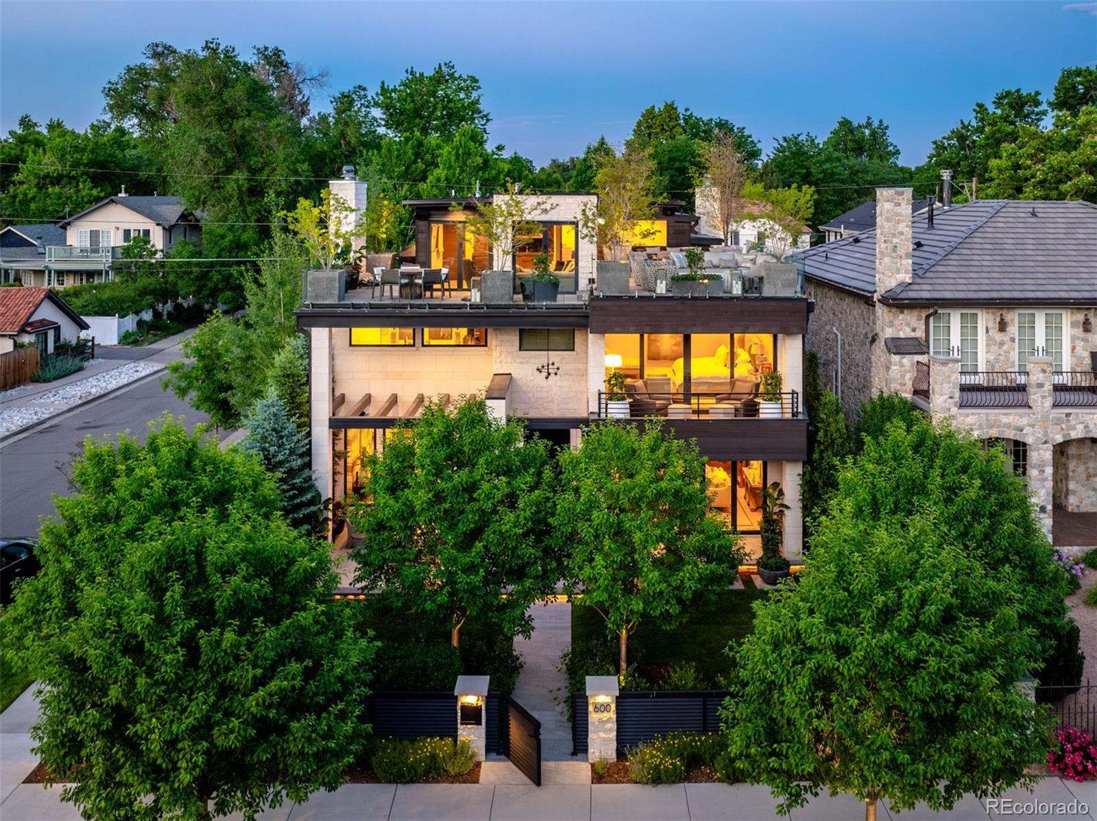 an aerial view of a house with a swimming pool and garden view