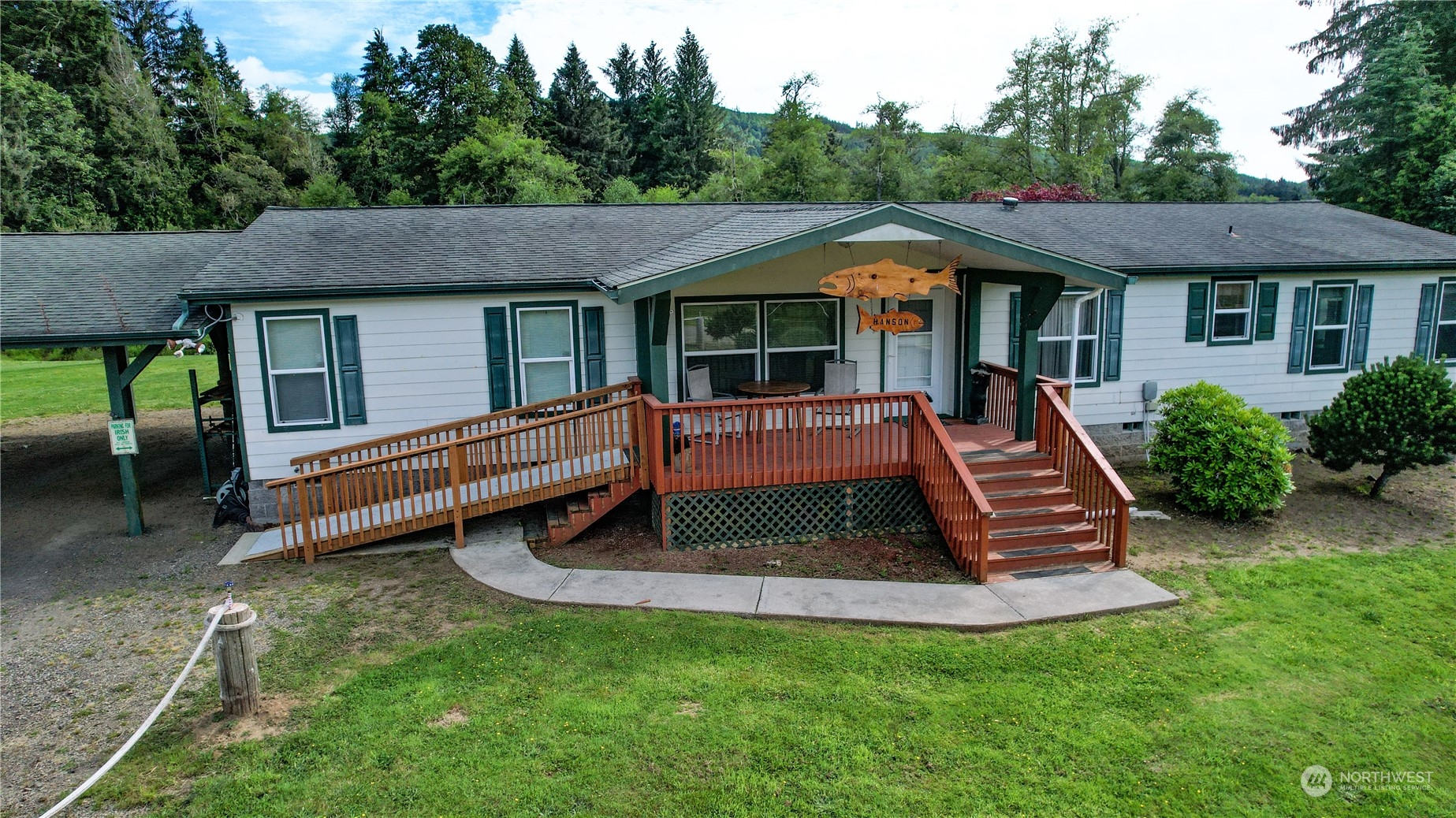 a front view of house with a garden