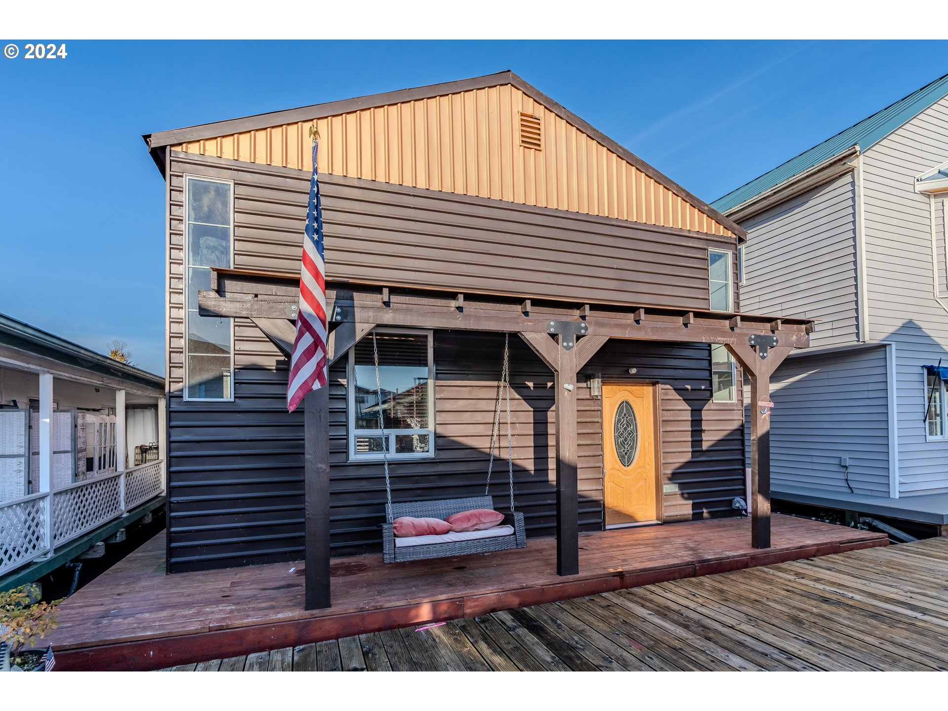 a view of a house with wooden deck