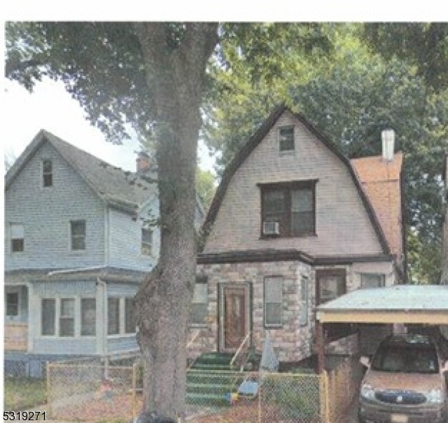 a aerial view of a house with a yard