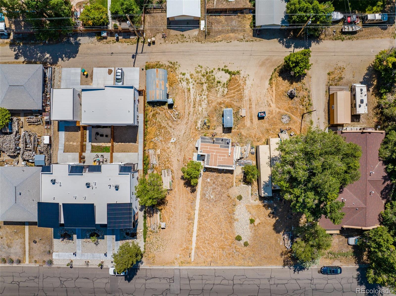 an aerial view of residential houses with outdoor space