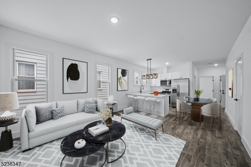 a living room with furniture and a table