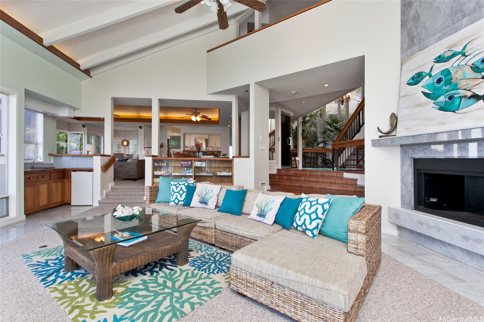 a living room with furniture and a fireplace