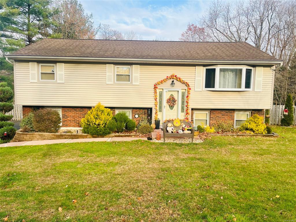 Bi-level home with a front lawn