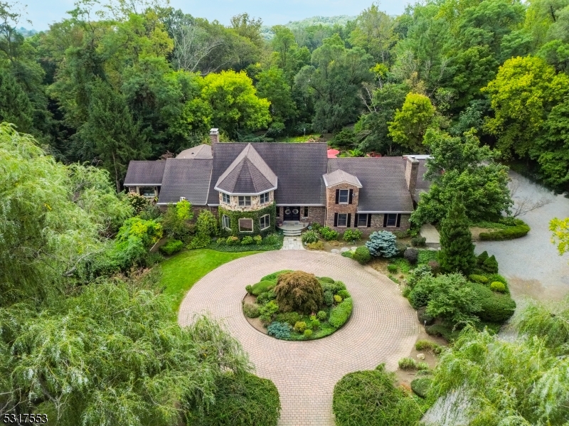 an aerial view of a house with outdoor space and street view