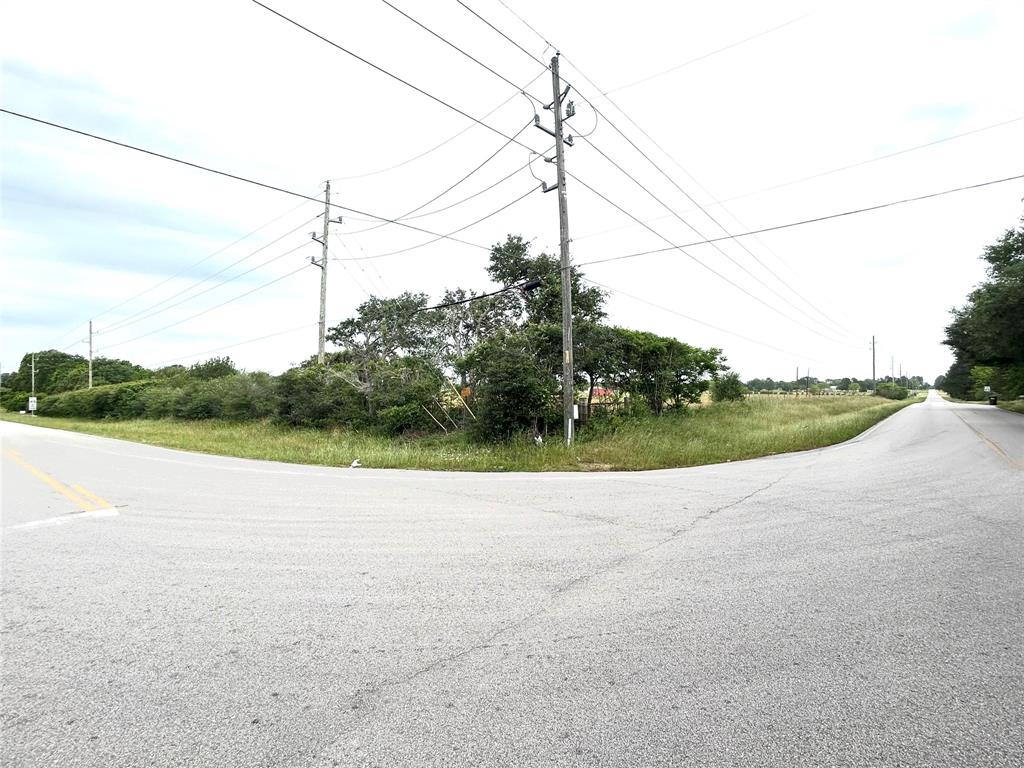 a view of a road with a yard