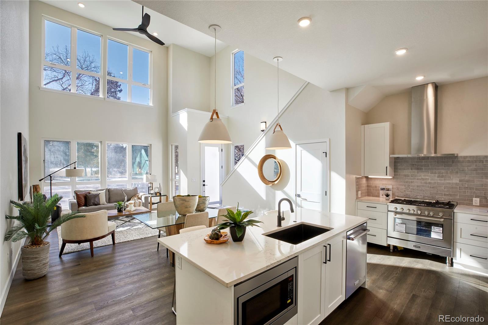 a kitchen with a stove and a clock on the table