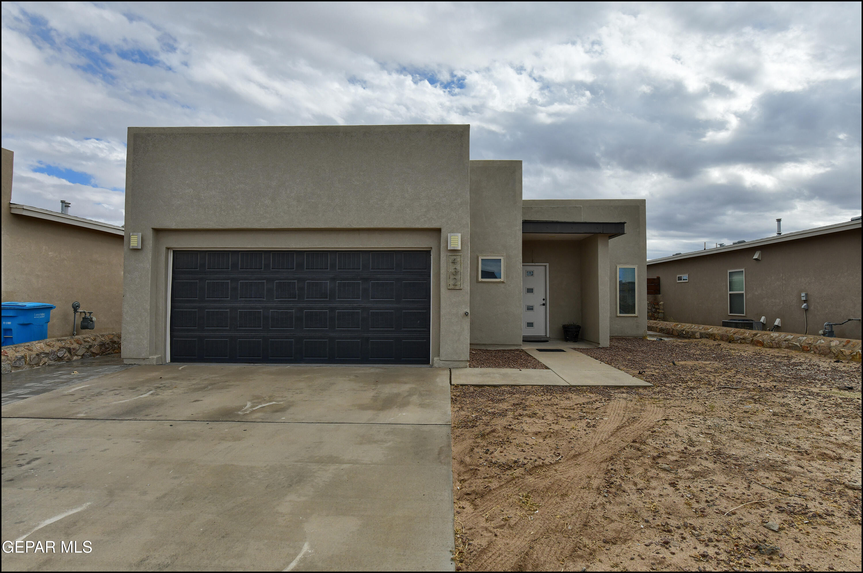 a front view of a house with a garage