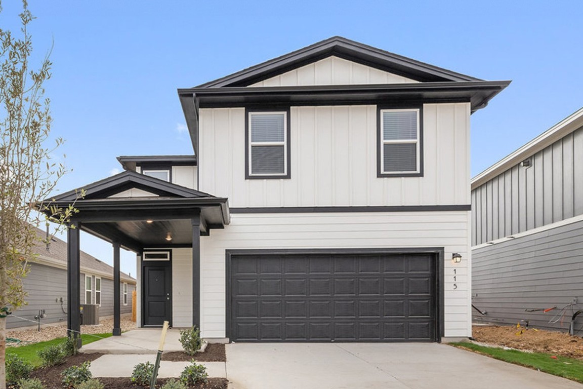 a front view of a house with garage