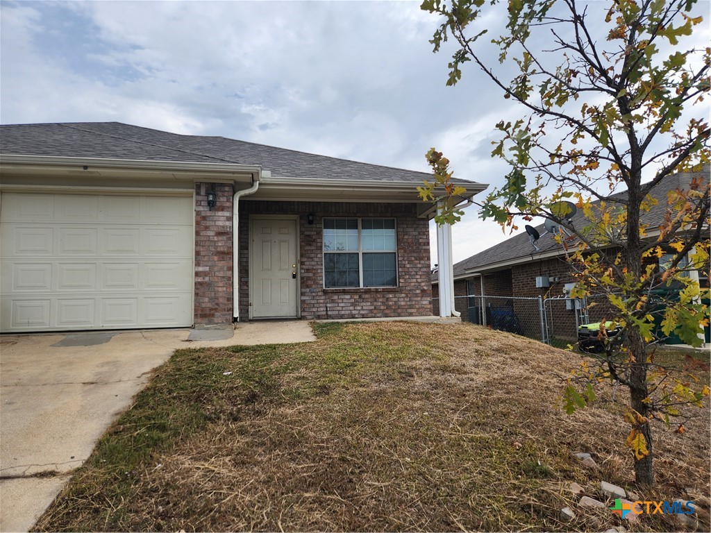 a house with yard in front of it