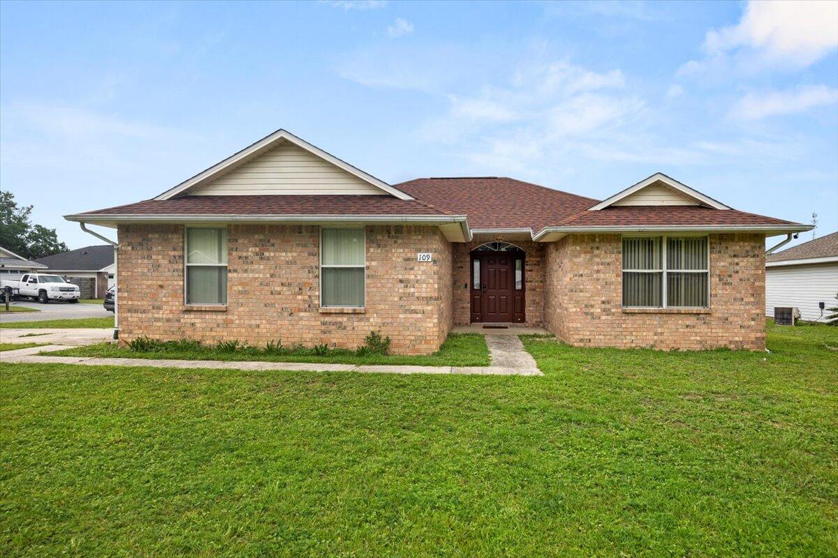 a front view of a house with a yard