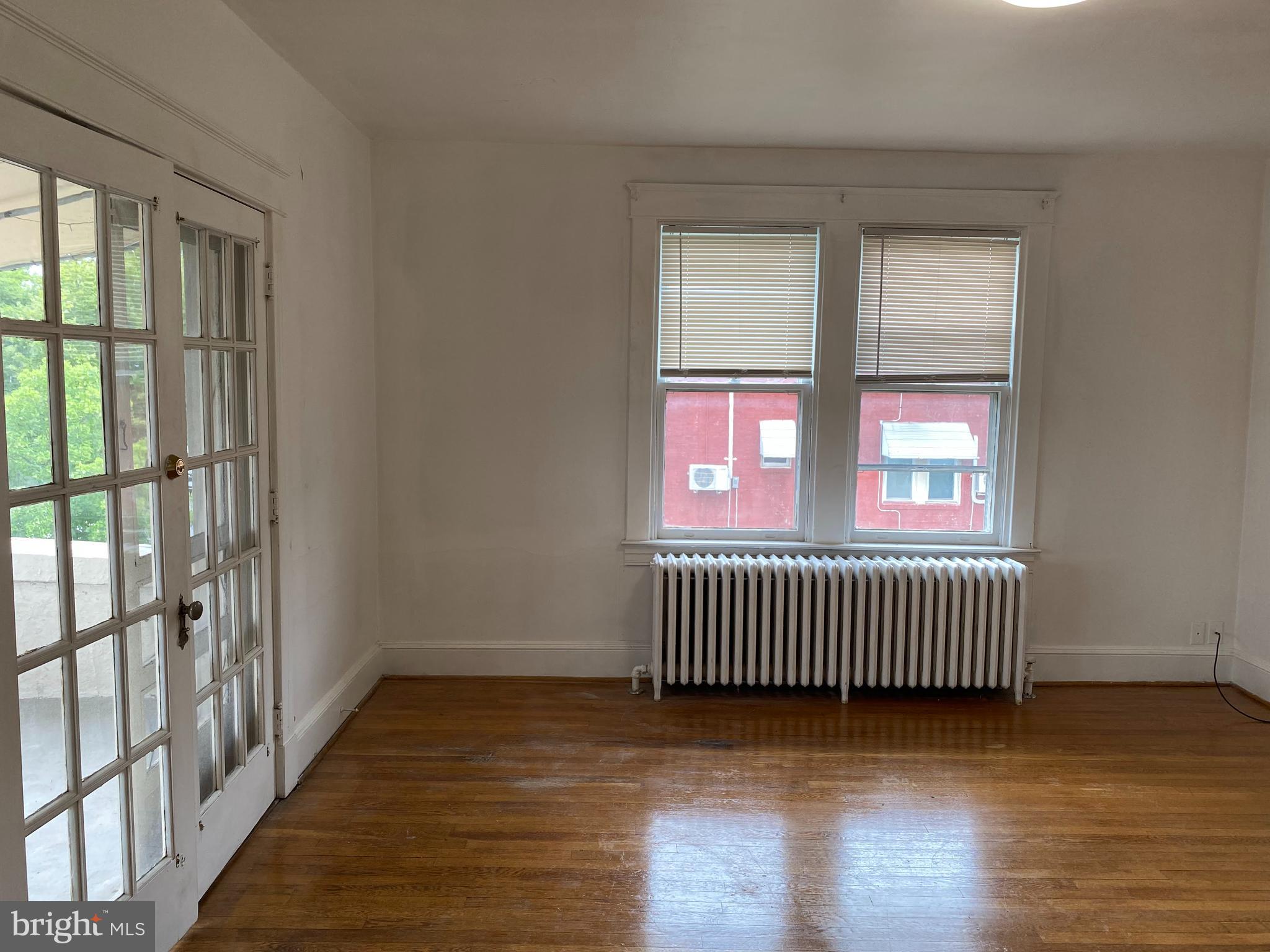 a view of porch with wooden floor