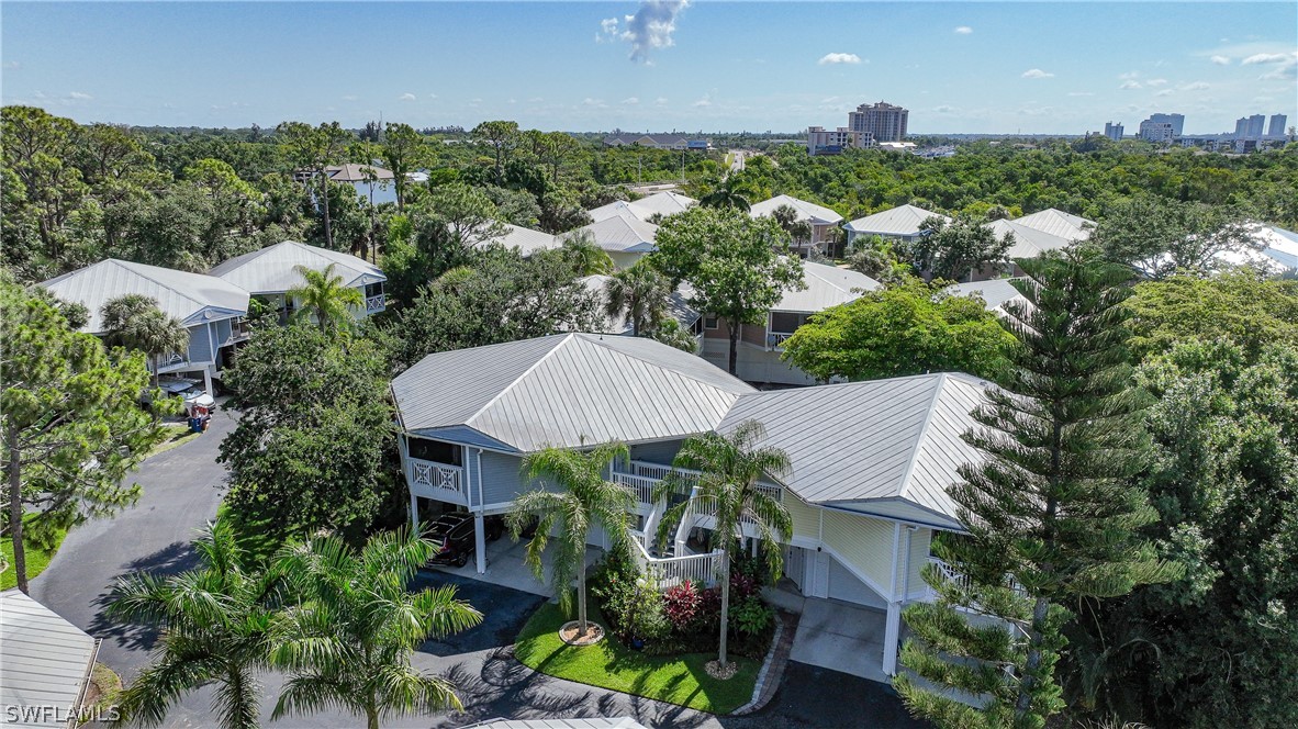 an aerial view of a house with yard swimming pool and outdoor seating