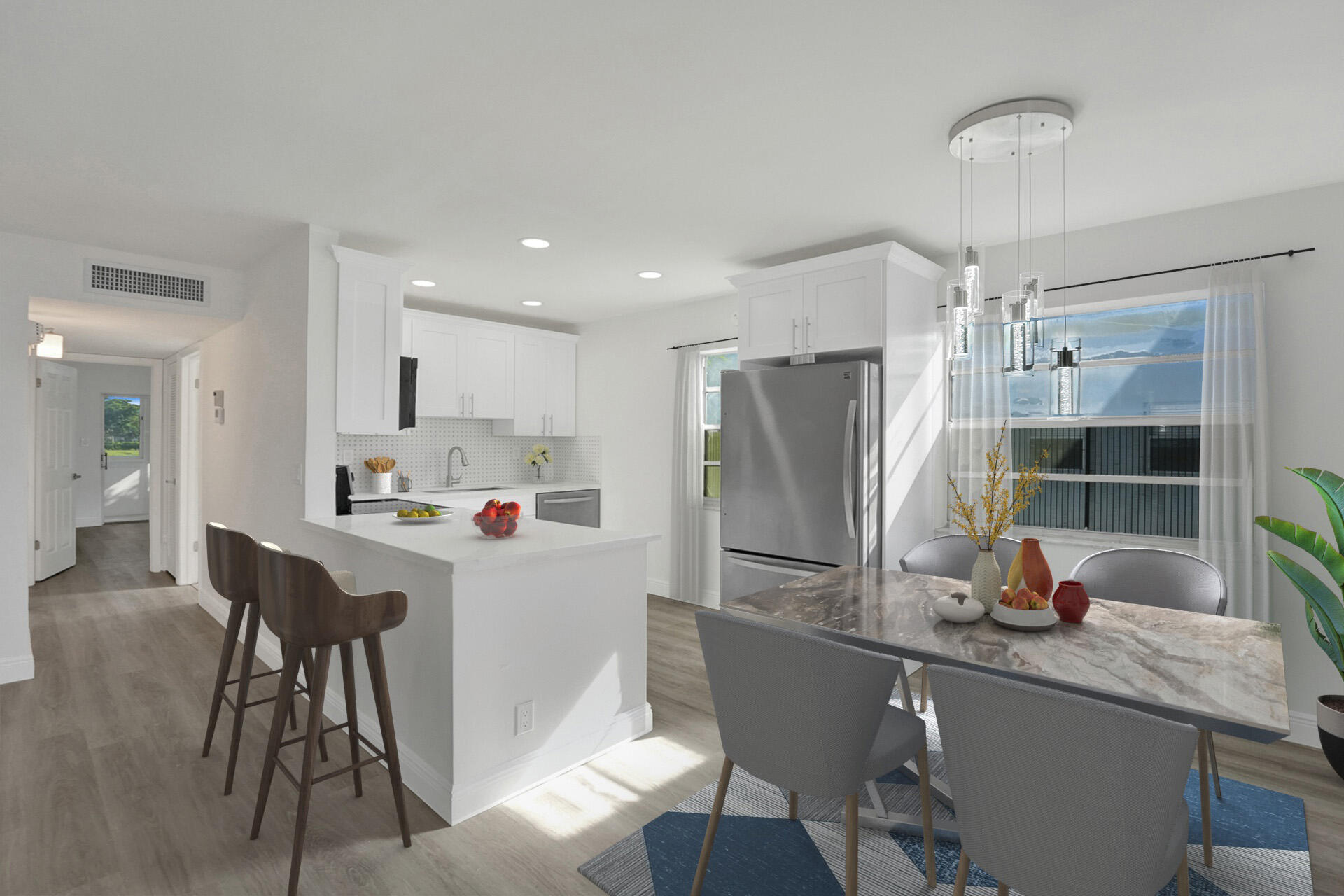 a kitchen with granite countertop a sink appliances and cabinets