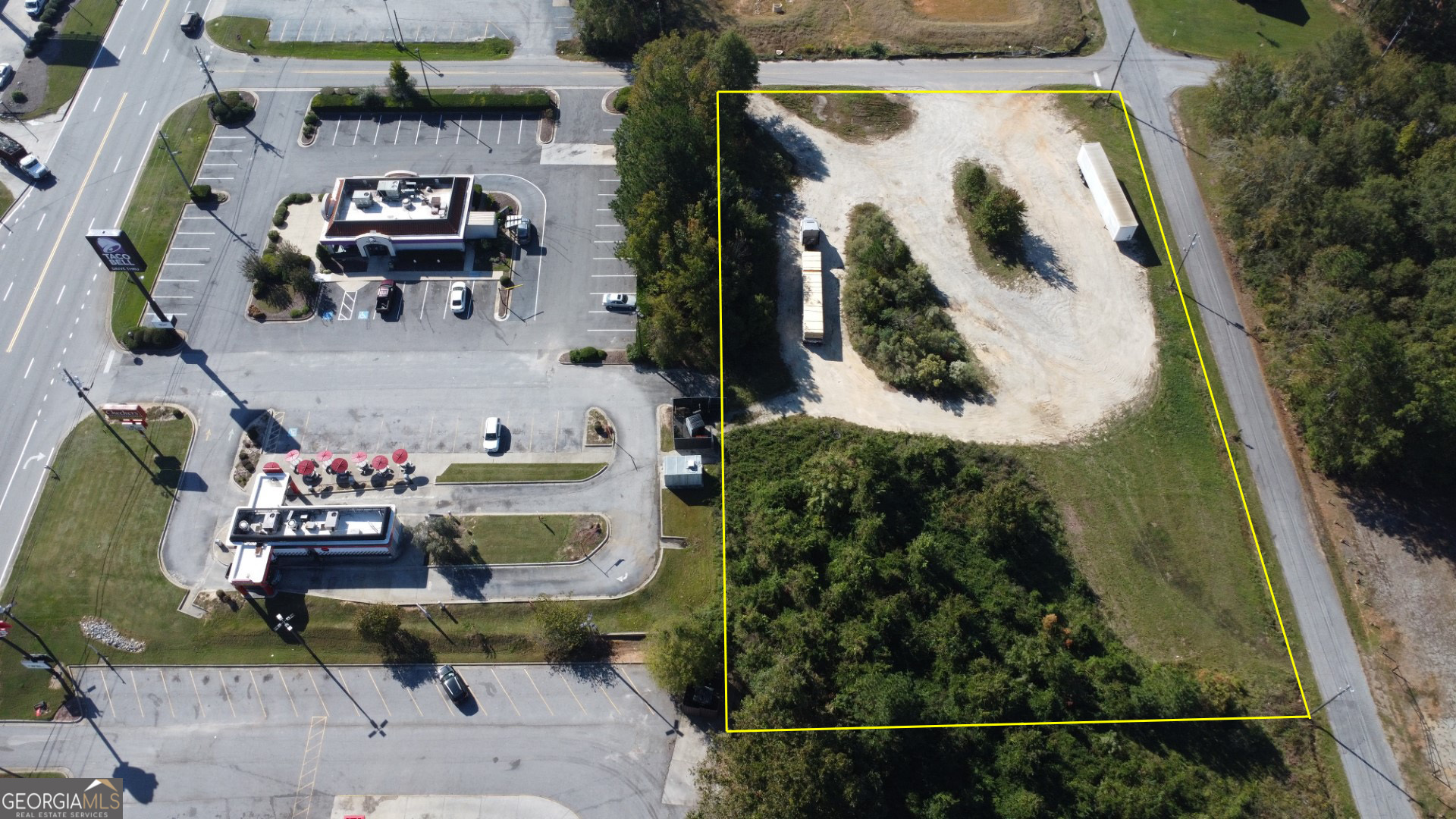 an aerial view of a house with swimming pool