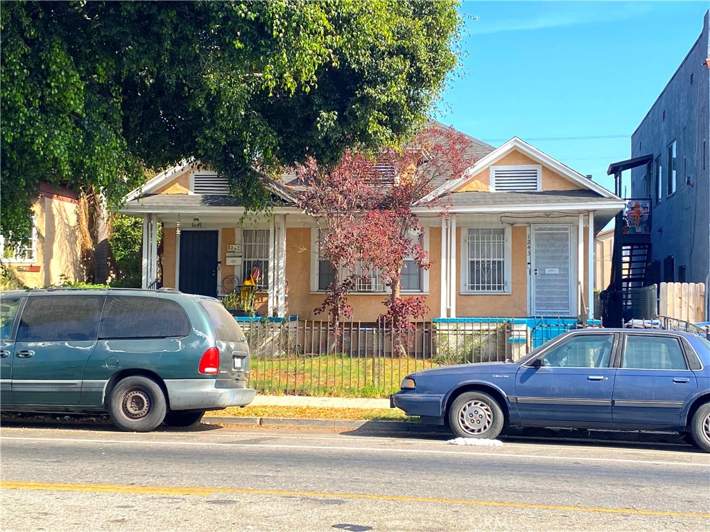 a front view of a house with parking space