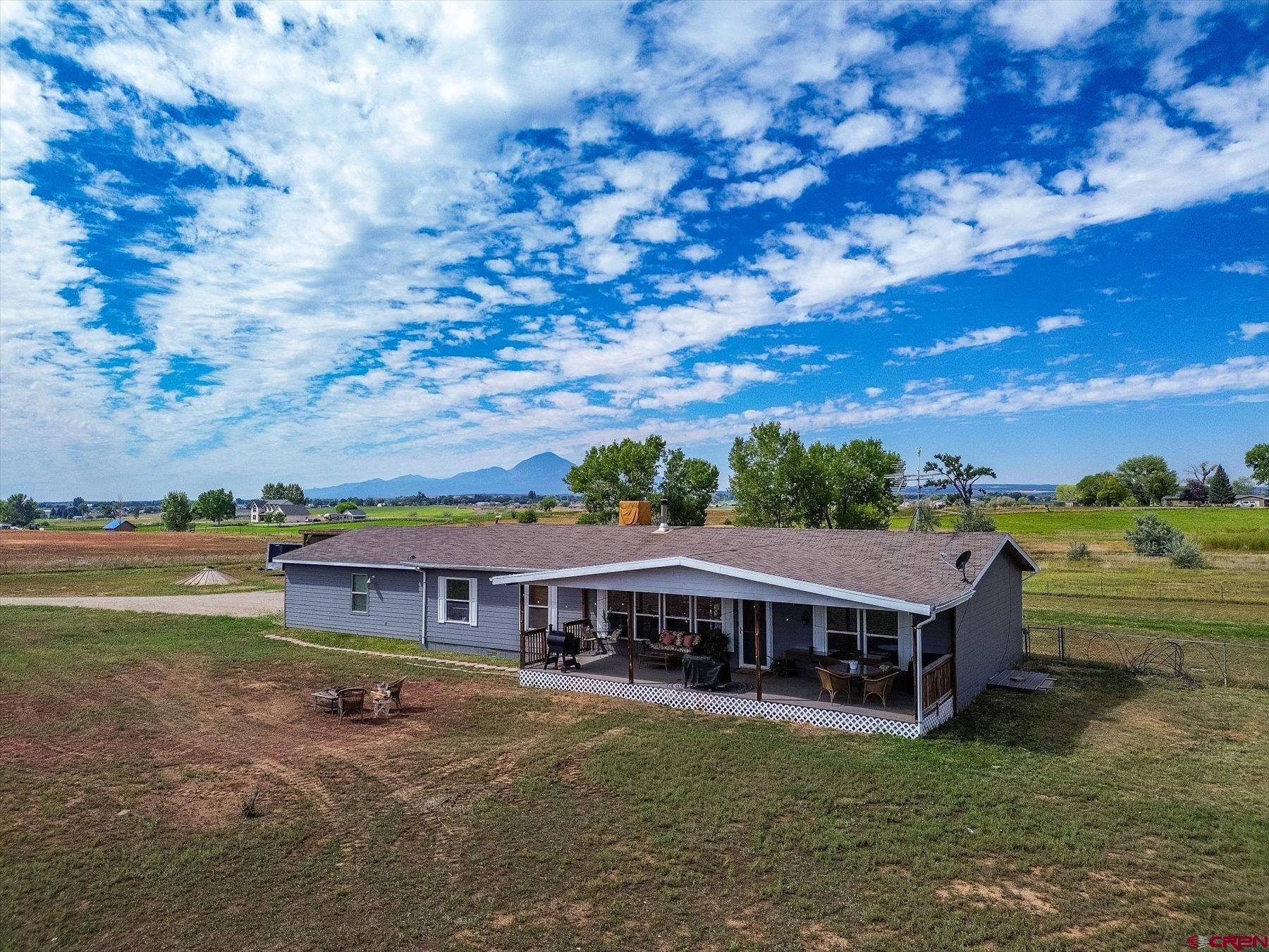 a view of a house with big yard