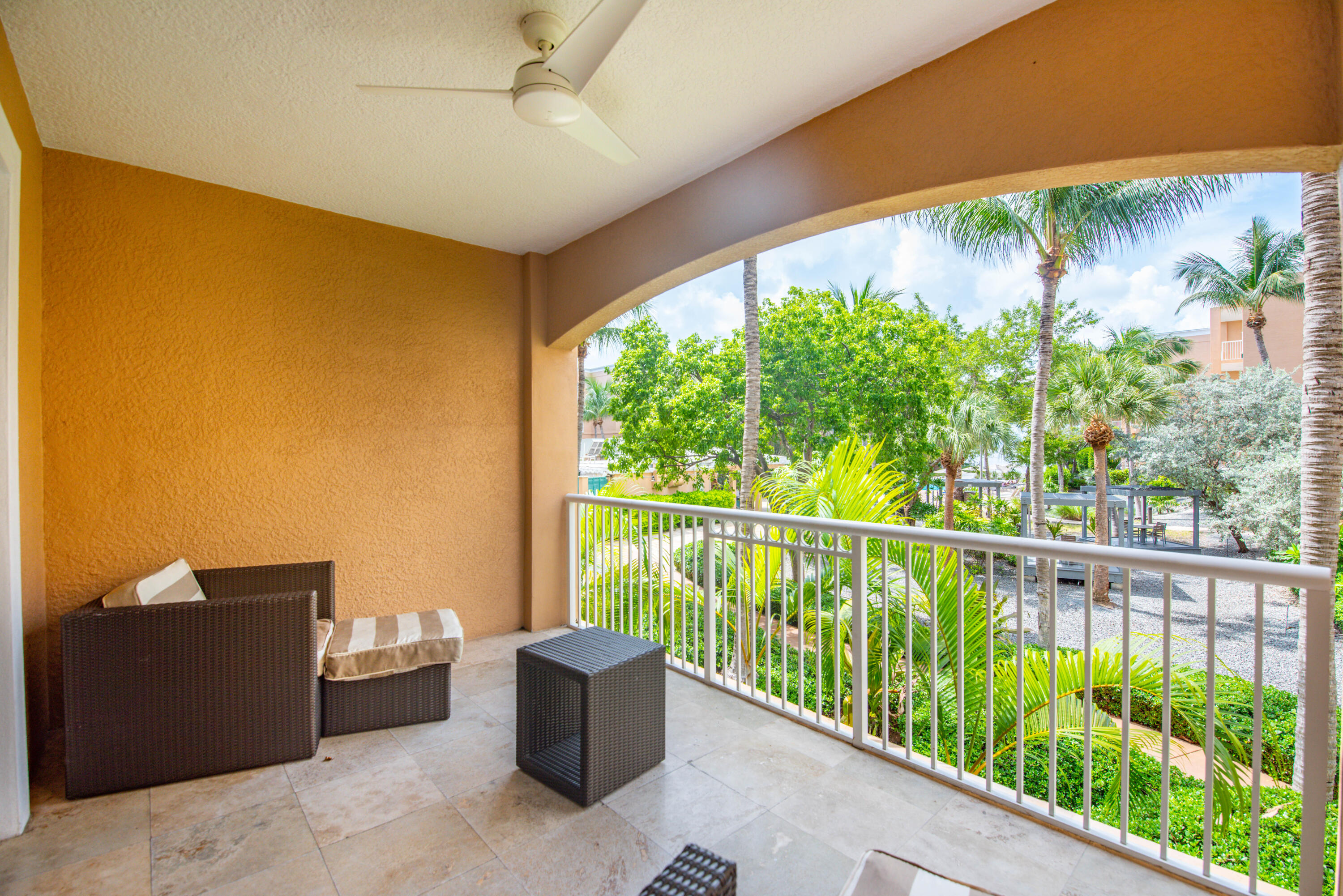 a view of balcony with furniture