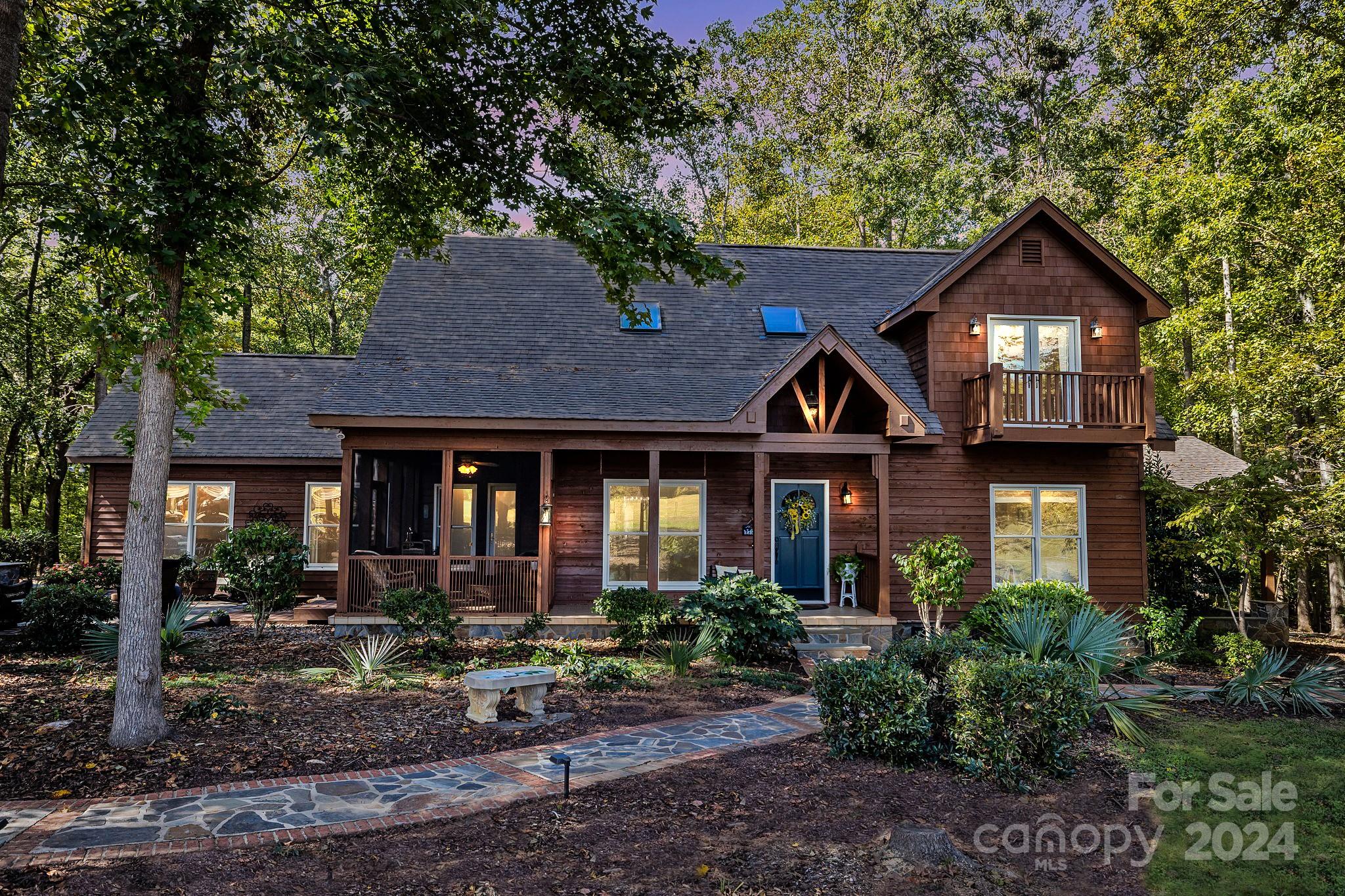 a front view of a house with garden