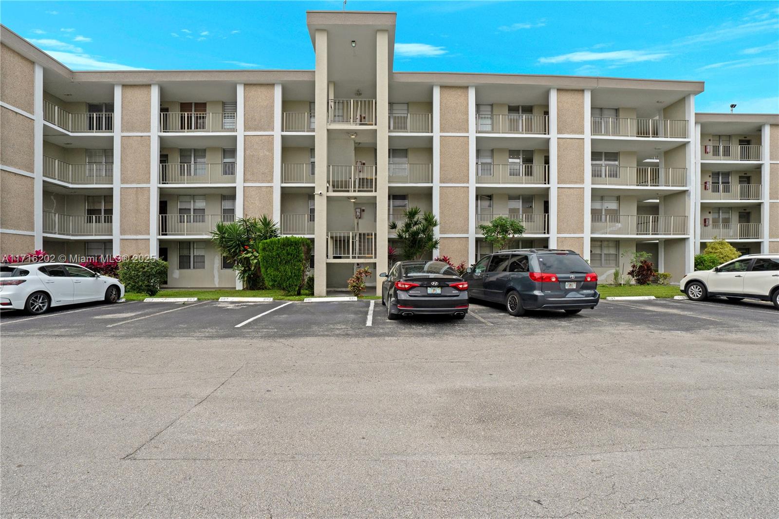 a building with cars parked in front of it