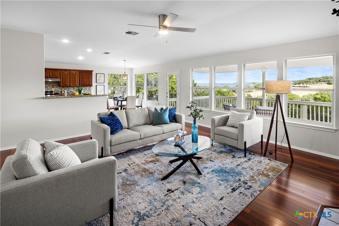 a living room with furniture and a rug