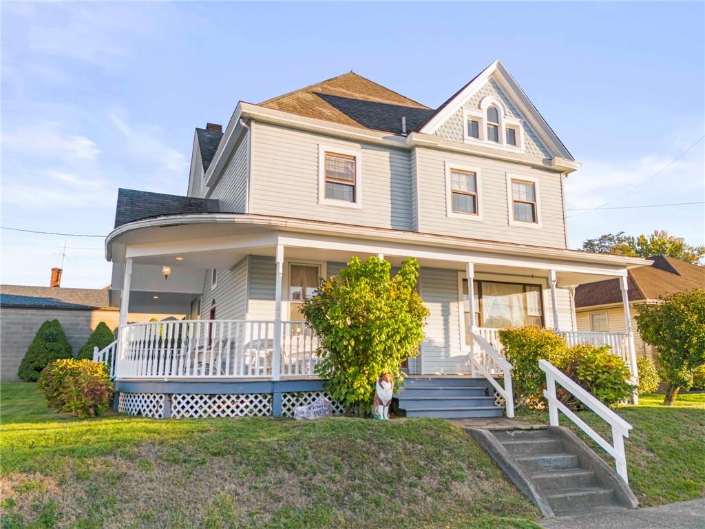 Awesome Wraparound Porch highlights this Monongahela Home featuring a MASSVE 6 Car Detached Garage & Concrete area for pets or play!