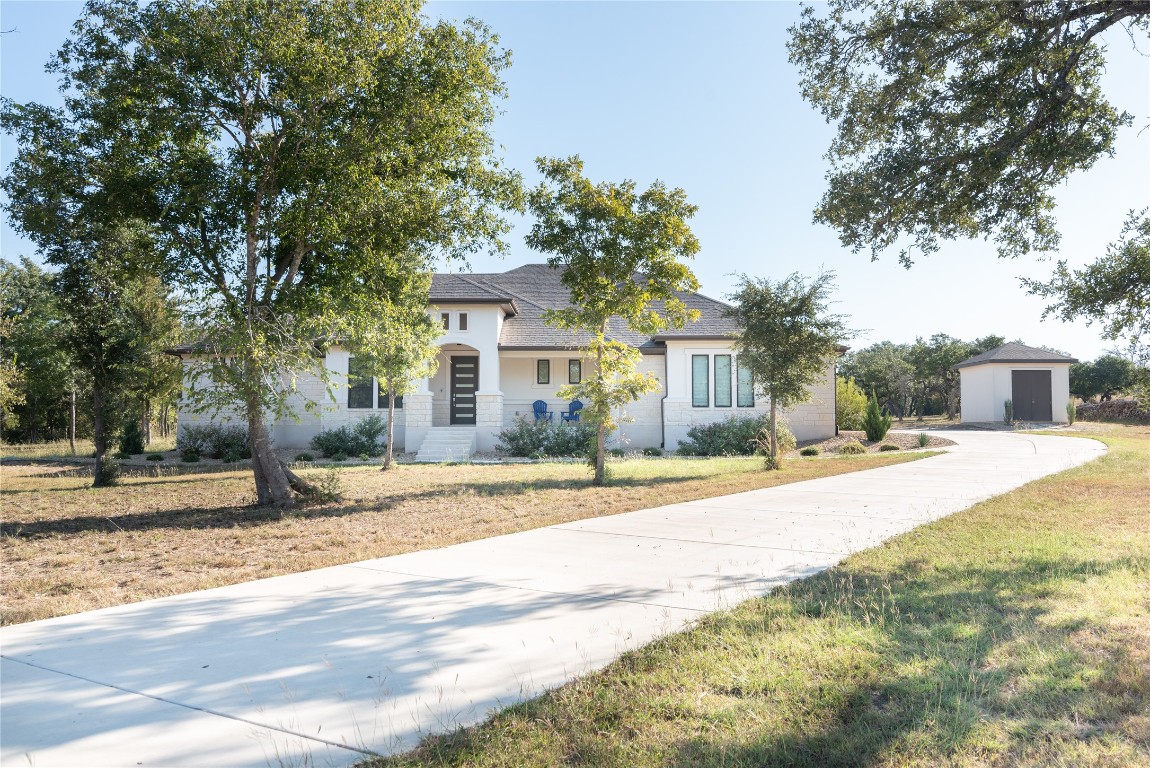 a front view of a house with a yard